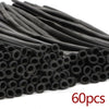A pile of matte black latex balloons for party decorations and balloon artistry.