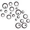 Black polka dot wall stickers scattered across a white background