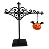 Black wrought iron antique library lantern with a hanging carved pumpkin light.