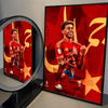 A framed canvas wall art print featuring Lamine Yamal celebrating a goal in a red and gold football kit.