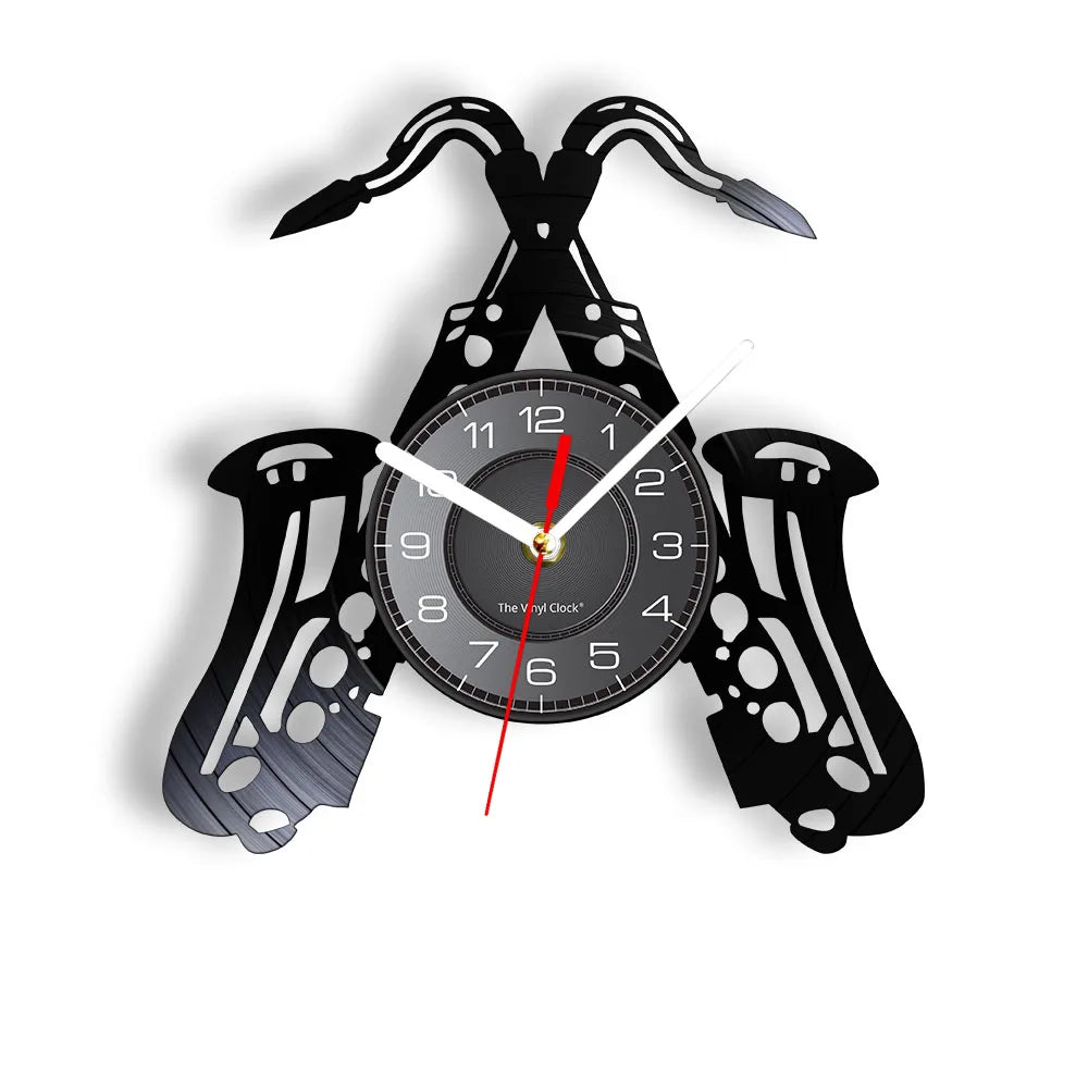 A black vintage vinyl record wall clock featuring a clock face and stylized horns.