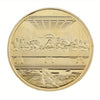 A round gold-plated commemorative coin featuring a relief sculpture of the Last Supper.