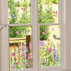 Window decals featuring colorful butterflies and wildflowers on a glass pane