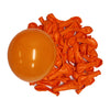 A pile of vibrant orange latex balloons next to a large, inflated orange balloon.