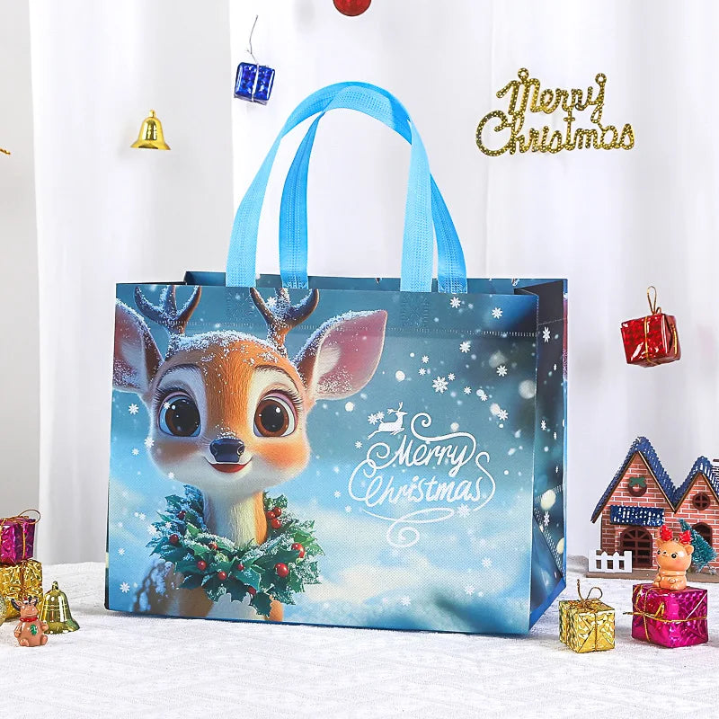 A blue reusable non-woven Christmas gift bag featuring a reindeer face design and sparkling holiday decorations.