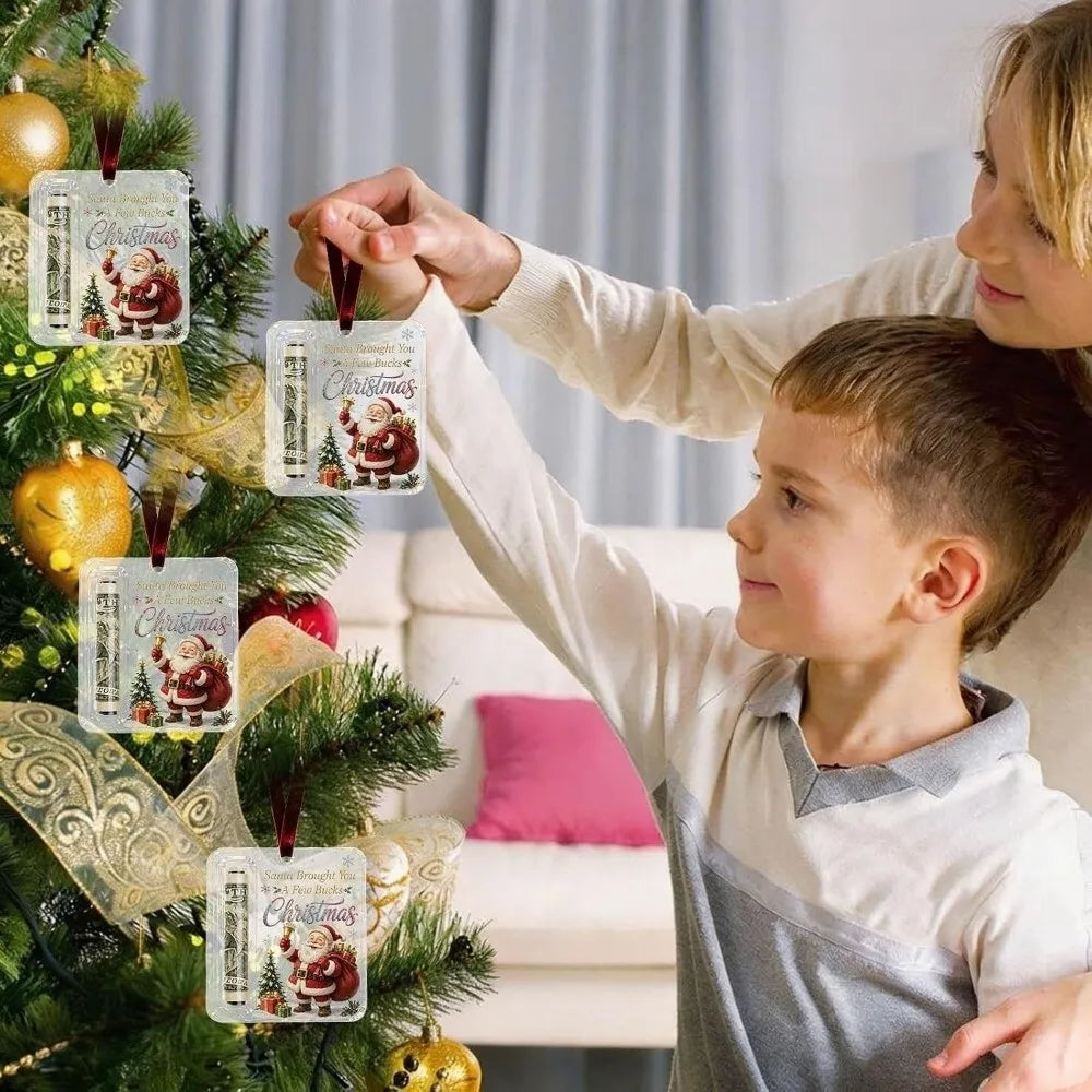A young child is hanging an acrylic Christmas cash gift ornament with a velvet ribbon on a decorated Christmas tree.