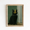 A framed canvas art print featuring a black cat with yellow eyes sitting in a green and cream patterned room.
