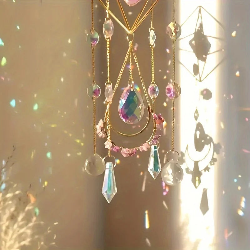 A hanging crystal suncatcher featuring amethyst and clear glass beads with golden accents.