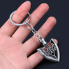 Silver metal keychain featuring an arrow design from JoJo's Bizarre Adventure