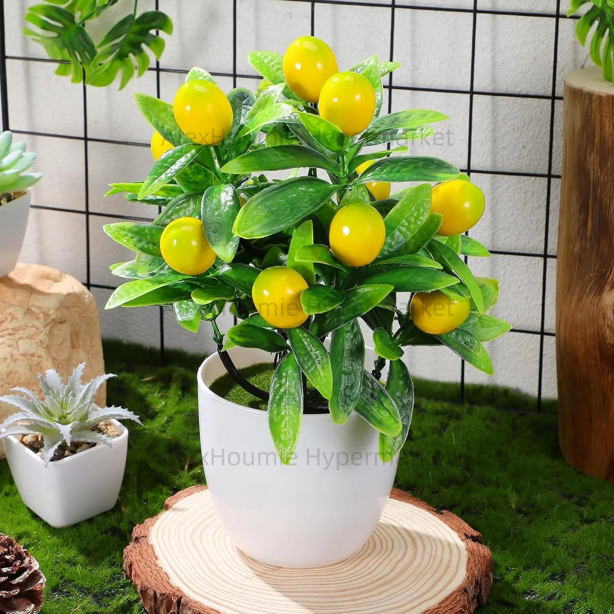 Artificial lemon tree bonsai plant with bright yellow fruit in a white pot