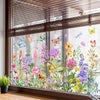 A window decal featuring colorful butterflies and flowers on a glass pane.
