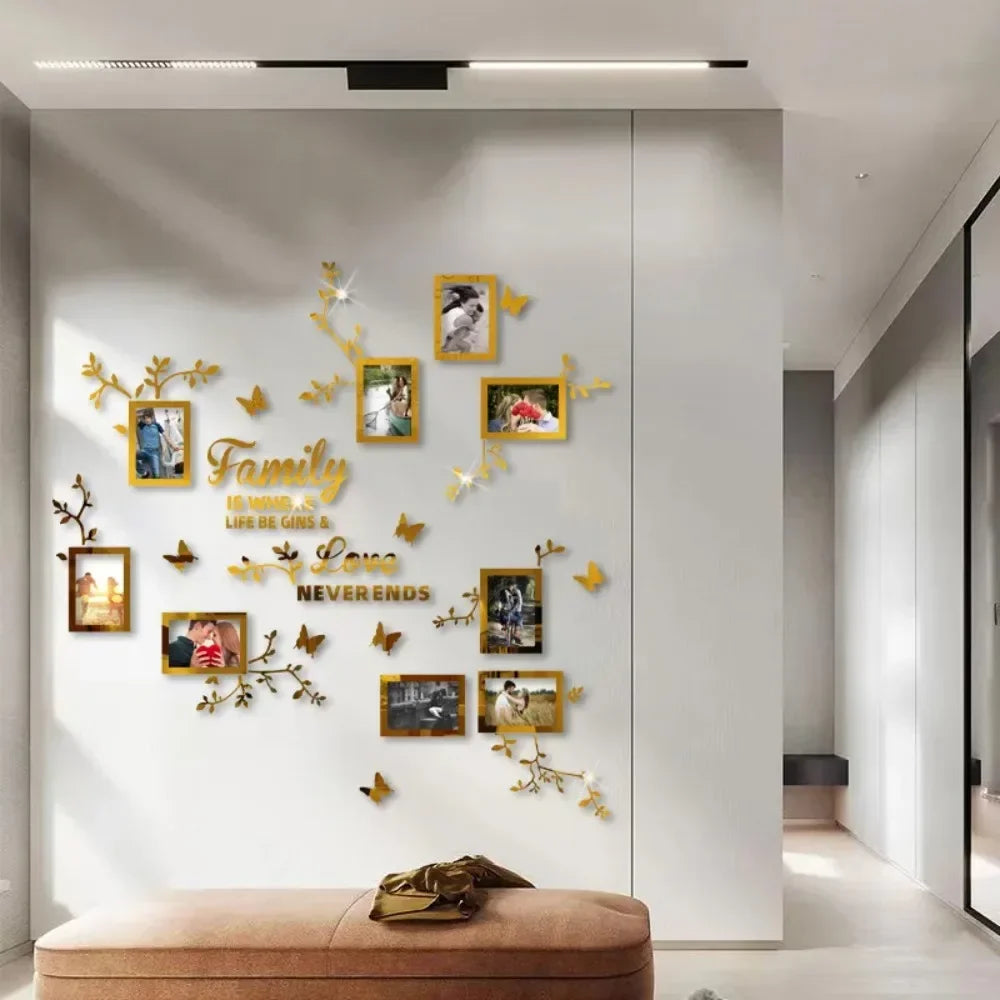 A white wall decorated with gold-toned floral branches and framed photos, featuring the text Family and Love.