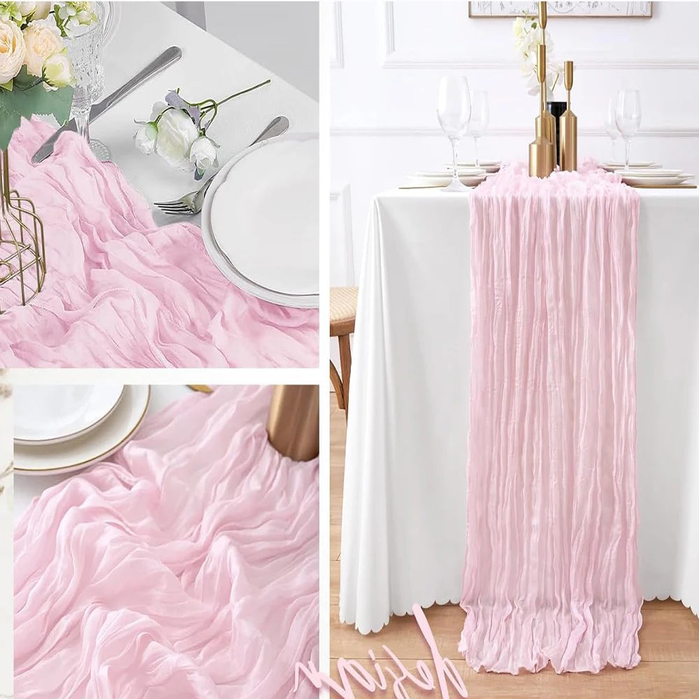 A rustic pink semi-sheer gauze table runner draped on a white tablecloth, shown in detail and in use.