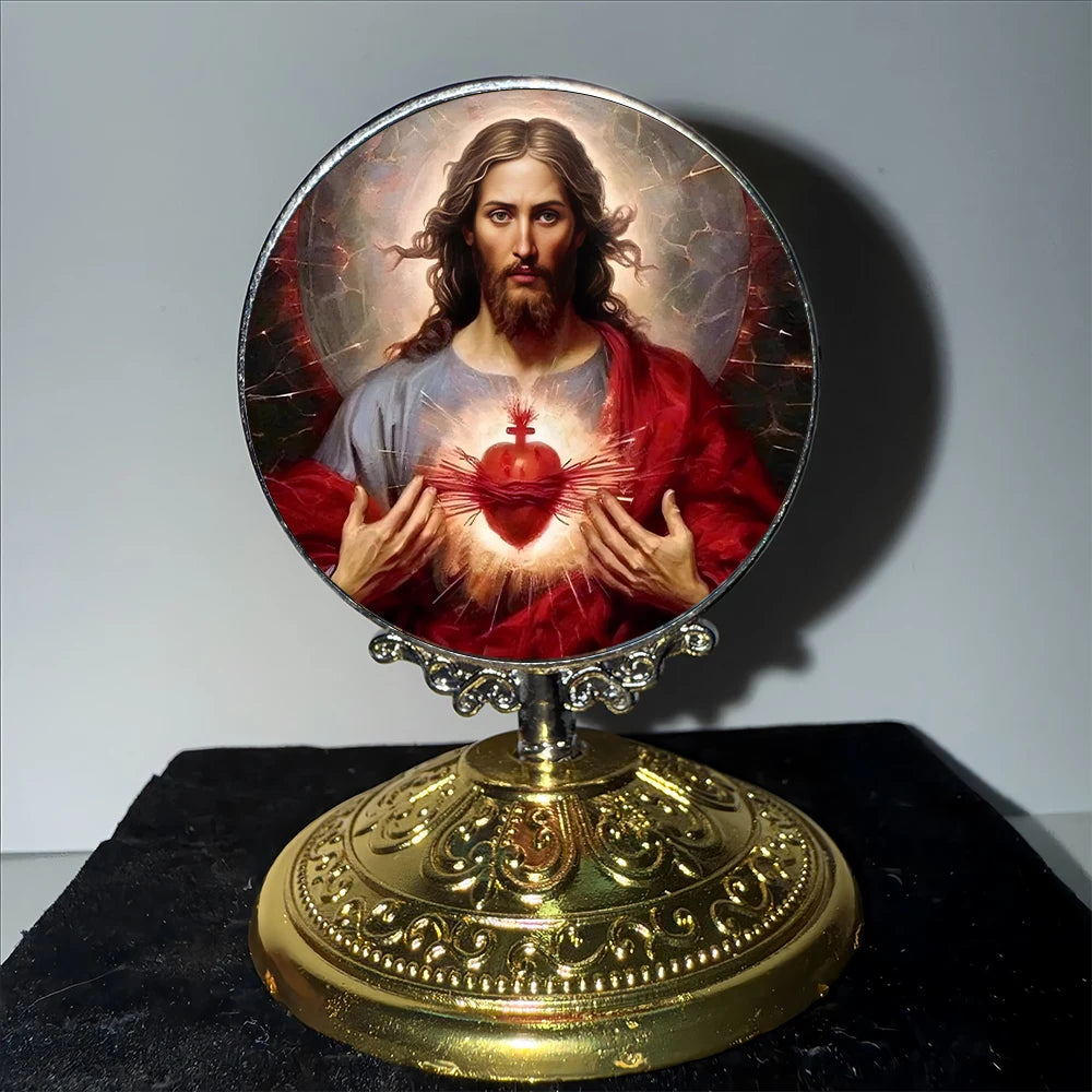 A framed image of Jesus Christ with a halo and a heart, set in a golden tabletop ornament.