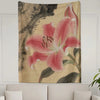 A wall tapestry featuring a large pink lily flower against a beige background.