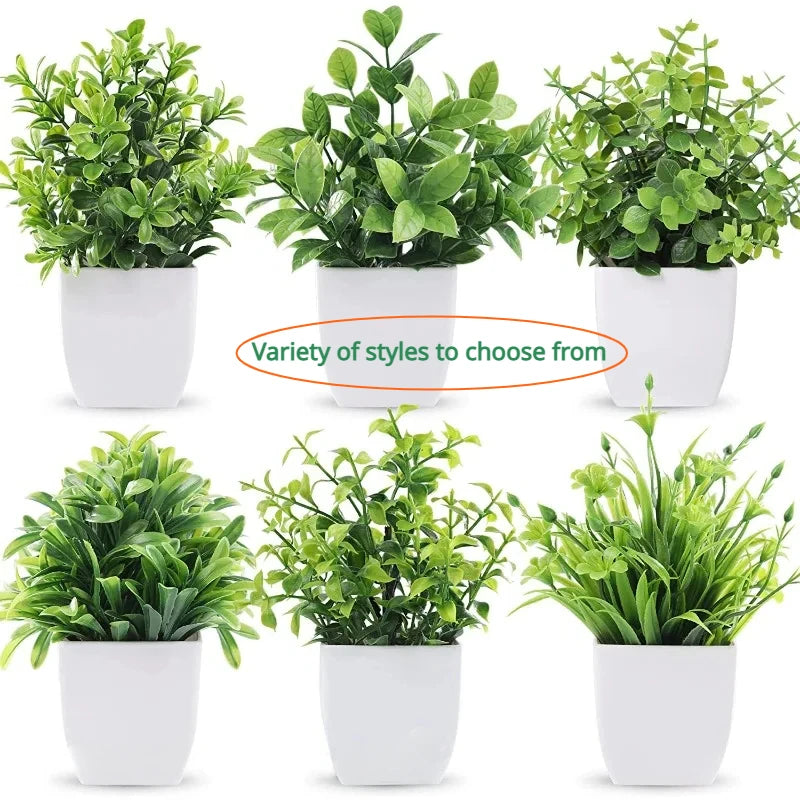 A collection of artificial bonsai plants in various styles and shades potted in white containers.