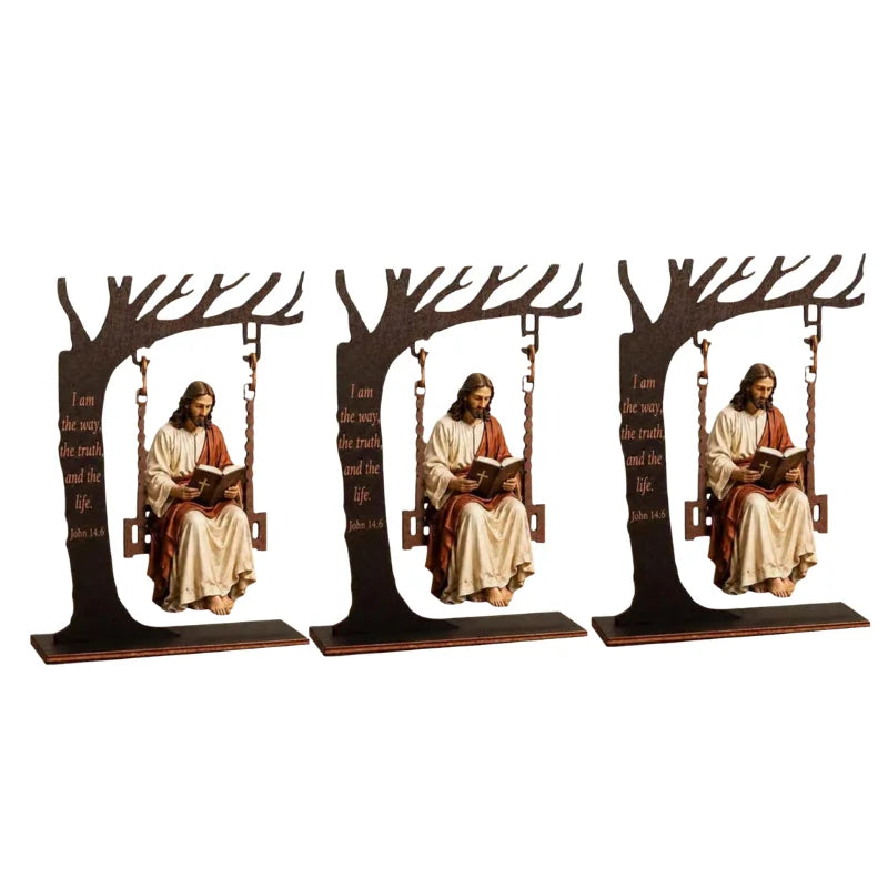 Wooden swing table display featuring Jesus figures and a Bible verse