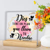 A framed print featuring the text Dios tiene un plan que lleva tu nombre in black script on a light background