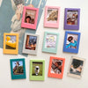 A collection of colorful magnetic photo frames displaying various photographs and text on a white background.