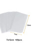 A stack of 100 clear cellophane treat bags with wire ties, showing a 7cm by 12cm size.