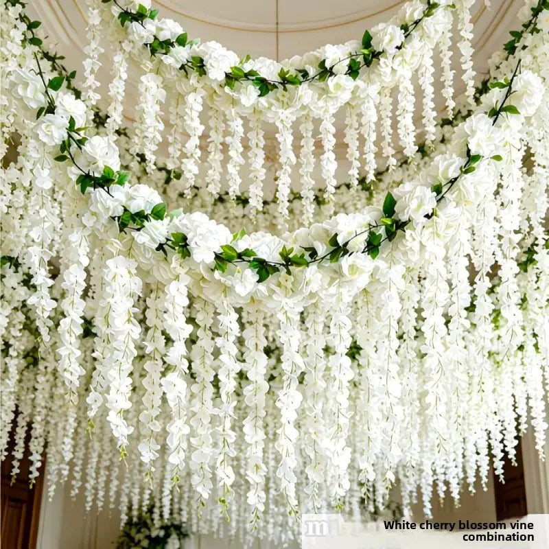 White silk wisteria hanging vine garland with white blossoms and green leaves