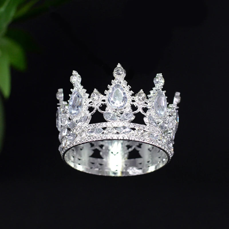 A sparkling silver tiara crown accessory with clear stones, suitable for a cake topper or hair decoration.