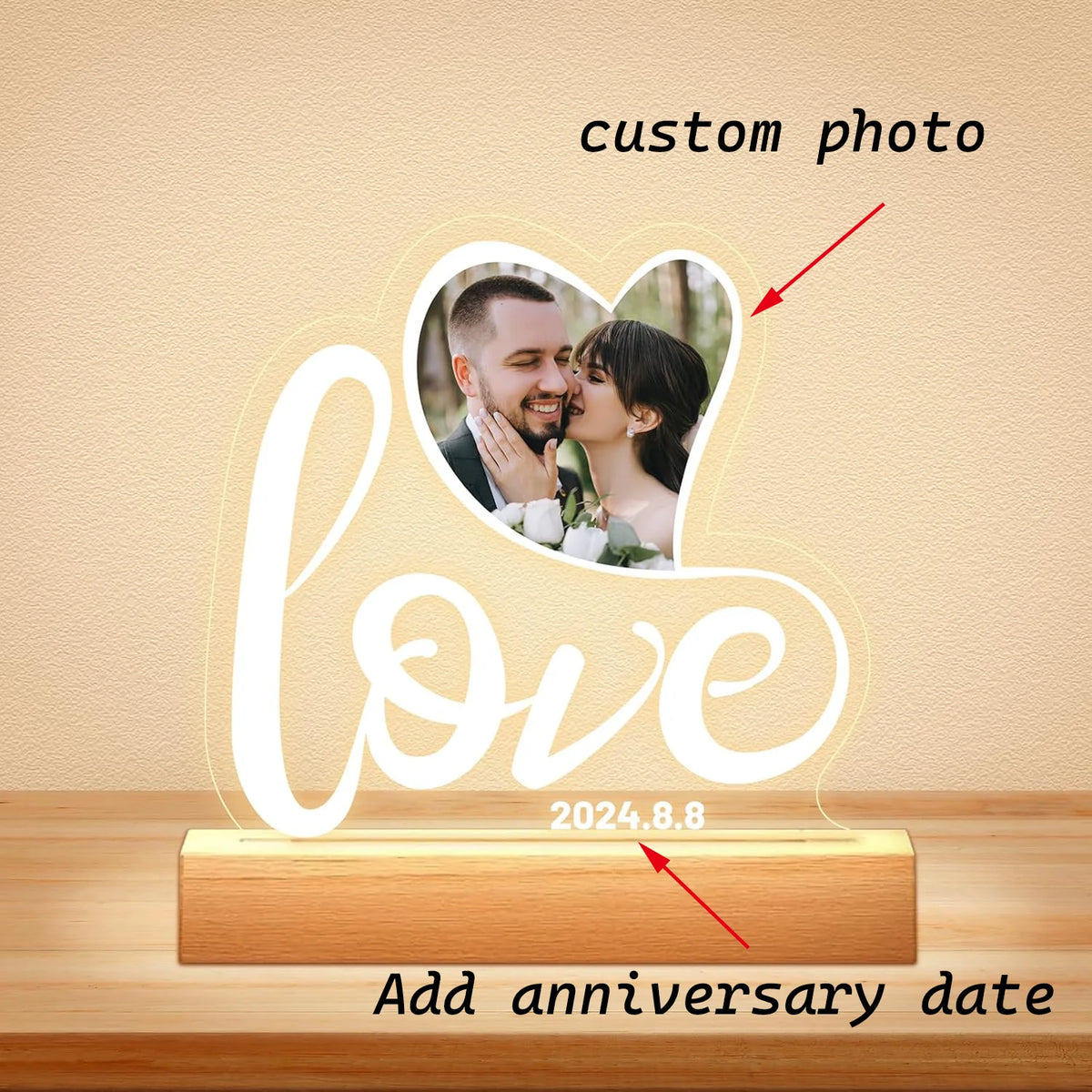 A clear acrylic photo frame displaying the word love and a custom photo of a couple, with space to add an anniversary date.