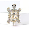 A vintage marine life brooch pin set featuring a gold-toned starfish design encrusted with clear and sparkling stones.