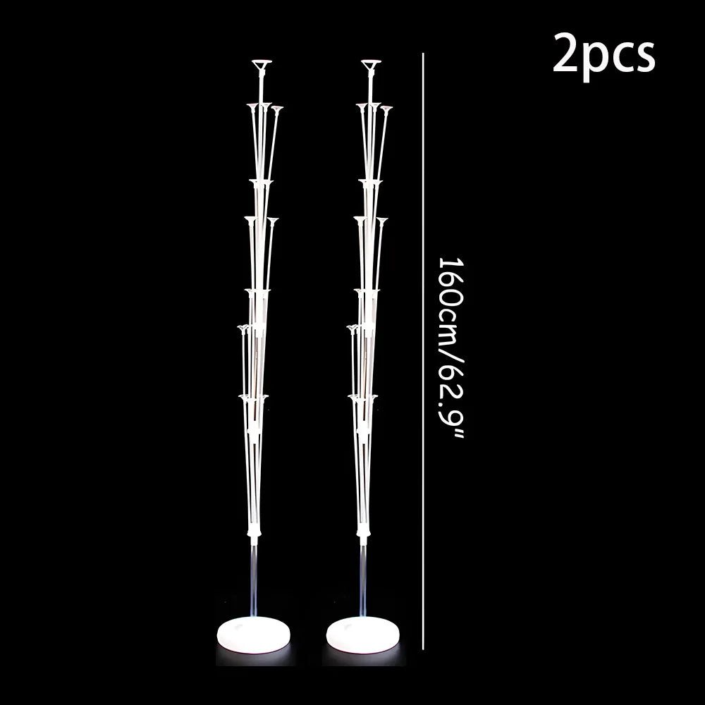 Two elegant white balloon column stands displayed vertically against a black background.