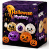 A box of Halloween Mystery toys featuring carved pumpkins and a ghost dumpling toy.