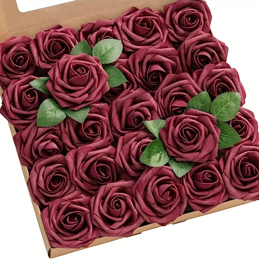 A box filled with deep burgundy artificial rose flowers with green leaves for DIY decor