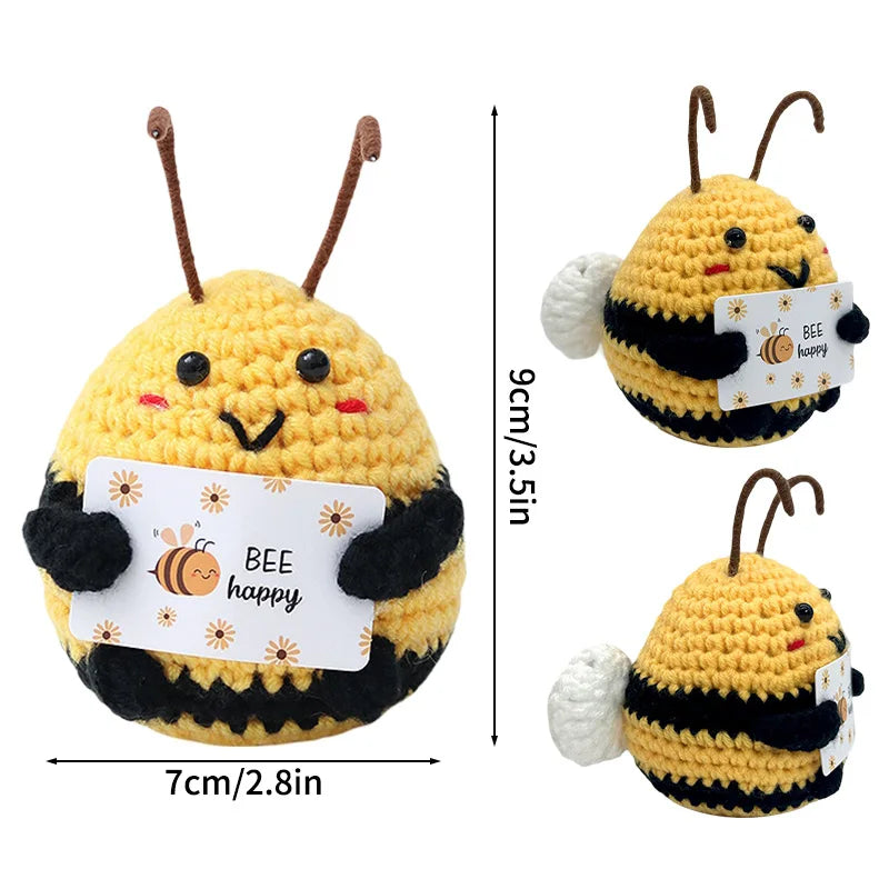 Handmade crochet bee doll with happy slogan on the body and a pocket for a hug gift