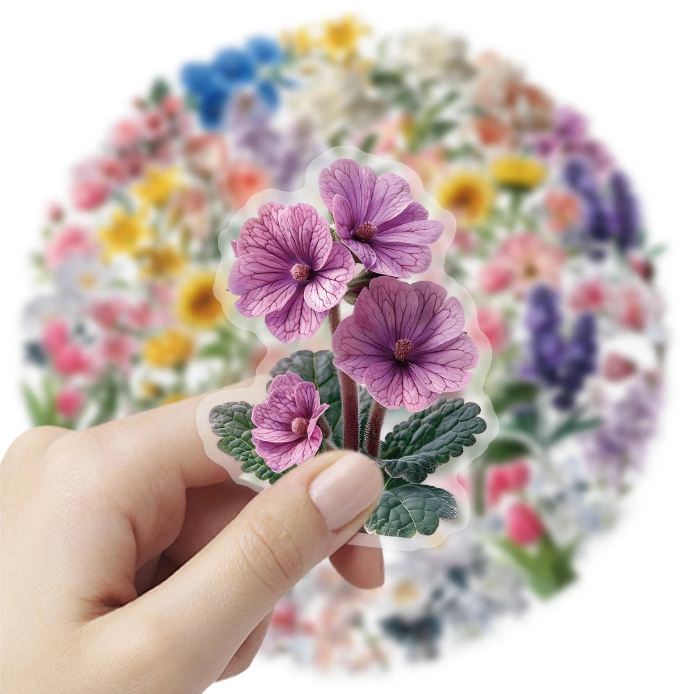A hand holds a sheet of aesthetic transparent flower decals featuring purple and pink flowers on a floral background.