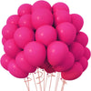A cluster of bright pink latex balloons tied together for parties and events.
