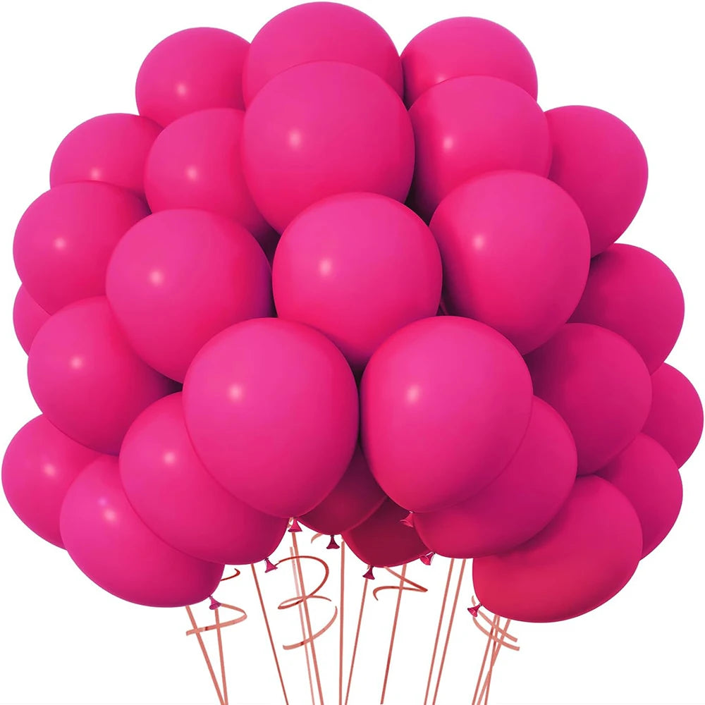 A cluster of bright pink latex balloons tied together for parties and events.