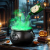 A black witch cauldron with an LED light and fog mist pouring green liquid in a dark, moody setting.