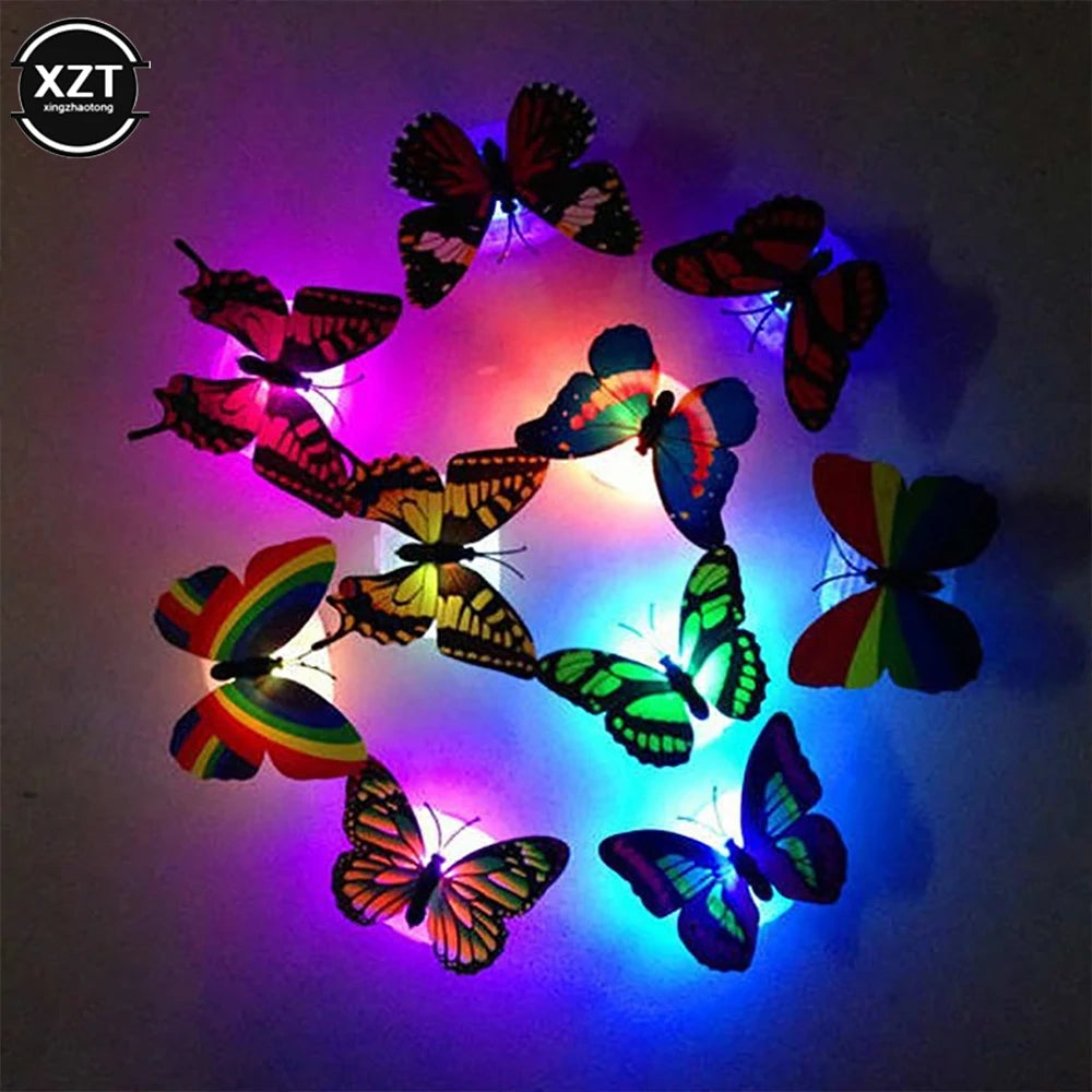 A display of colorful 3D LED butterflies illuminating a dark background.