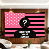 A pink and black American flag tapestry featuring stars and stripes with a question mark in the center.