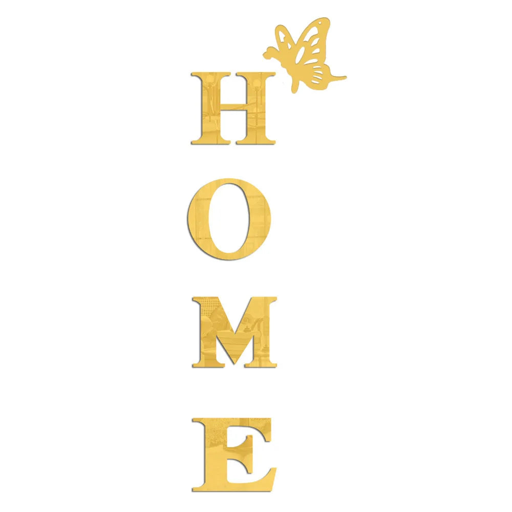 A set of gold acrylic wall stickers shaped like the word HOME and a butterfly.