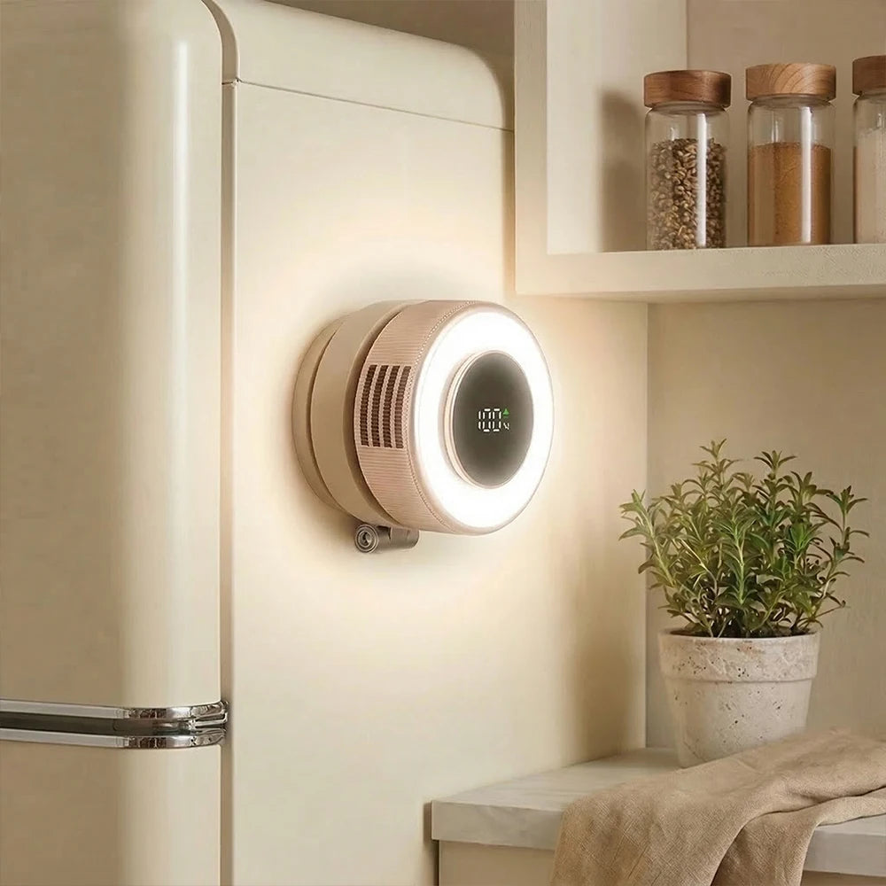 A magnetic bladeless handheld fan with a round light is mounted on a wall, next to some jars and a potted plant.