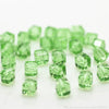 A collection of square cut green glass crystal beads for jewelry making