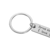 Silver stainless steel keychain with a rectangular tag engraved with the message Drive sa I love y