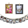A set of rustic wooden clip photo display frames with kraft paper, featuring floral and portrait images.