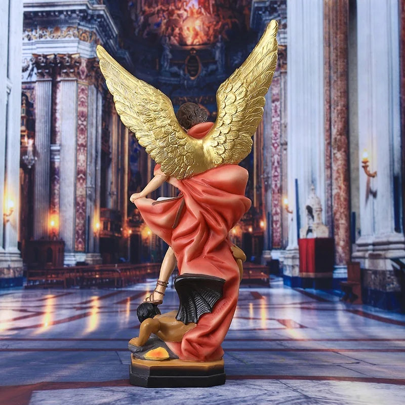 Bronzed Saint Michael Archangel resin figurine with golden wings standing on a pedestal.