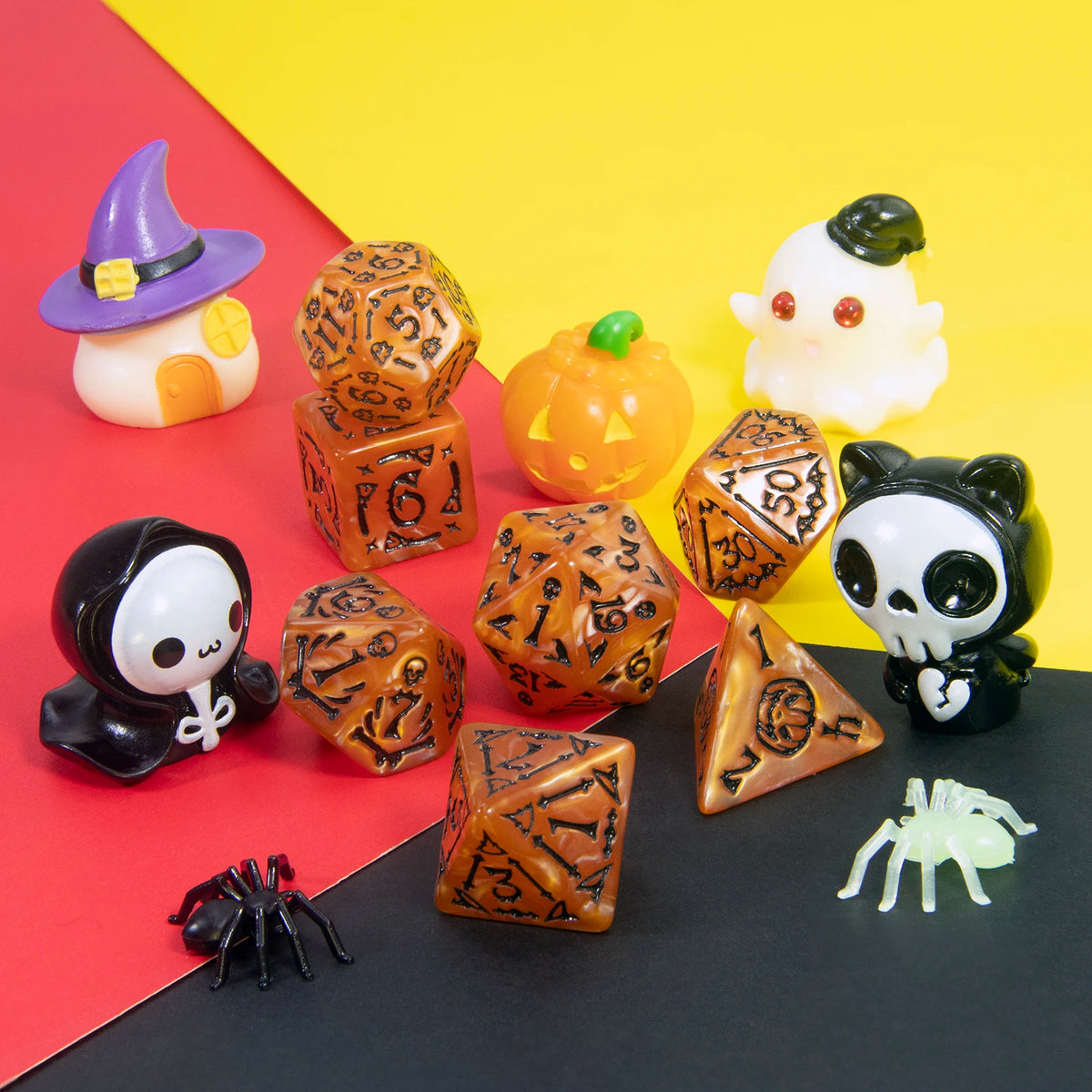 A set of seven polyhedral dice in various colors and shapes displayed on a black surface against a red and yellow background.