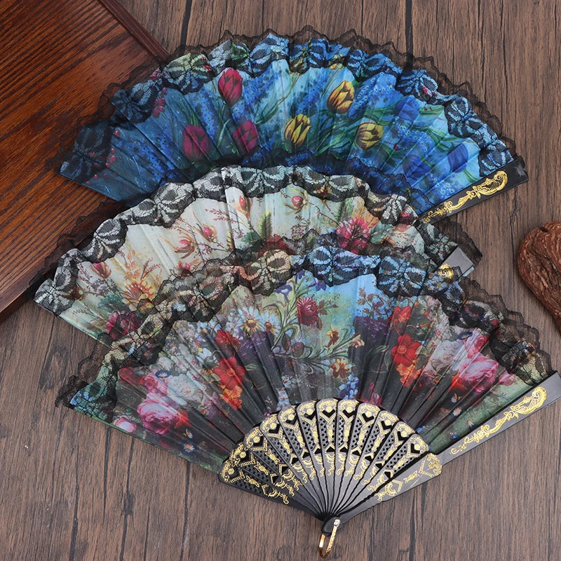 An elegant plum blossom folding fan with intricate floral patterns in blue, green, and red tones.