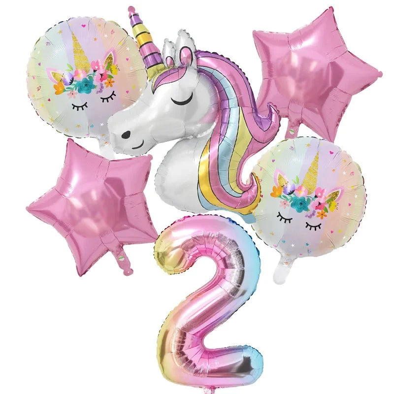 A set of pink and iridescent foil balloons featuring a unicorn and the number two for a birthday party.