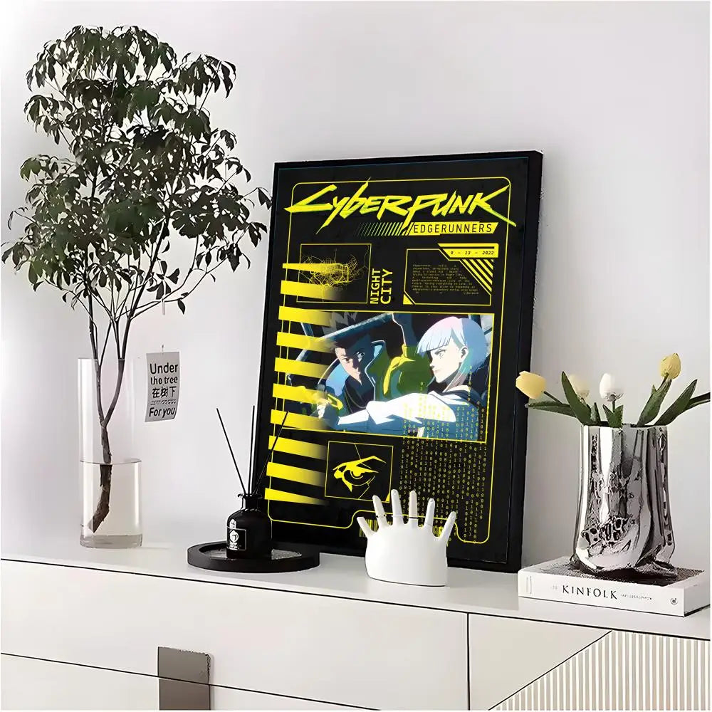 A framed poster of Cyberpunk Edgerunners featuring neon yellow and black graphics displayed on a white shelf.