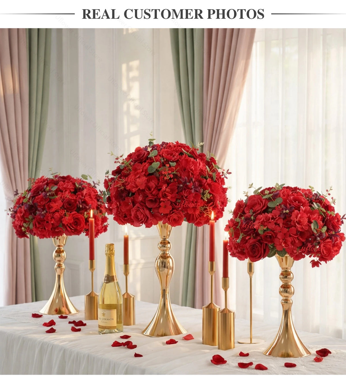A centerpiece featuring a red silk champagne rose and hydrangea flower ball surrounded by rose petals.