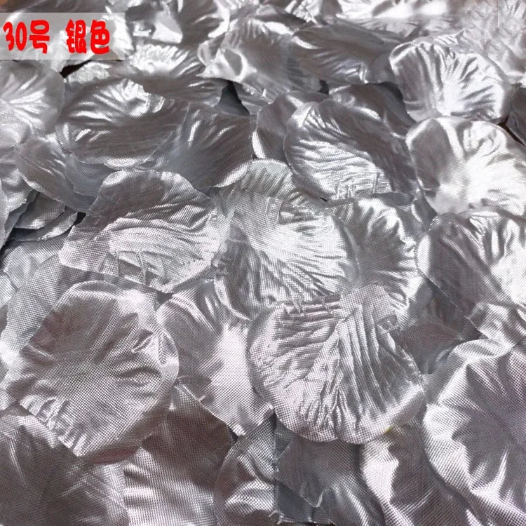 Pile of silver silk rose petals used for weddings and events